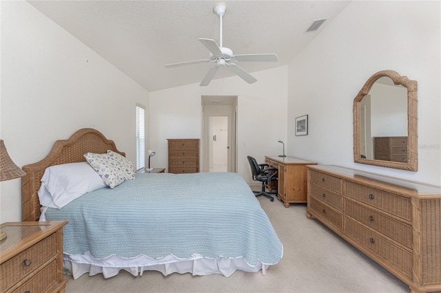 bedroom with lofted ceiling, light colored carpet, visible vents, and ceiling fan