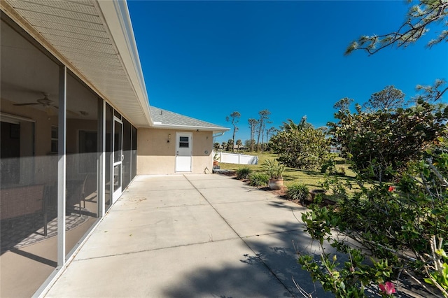 view of patio / terrace featuring a sunroom