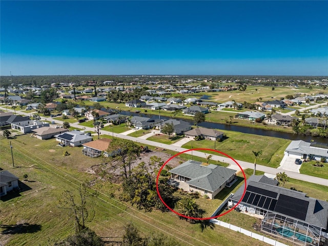 aerial view with a residential view and a water view