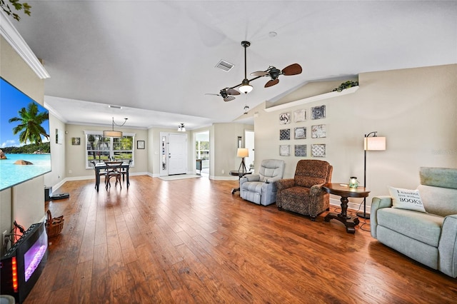 living room featuring visible vents, baseboards, ceiling fan, and hardwood / wood-style floors