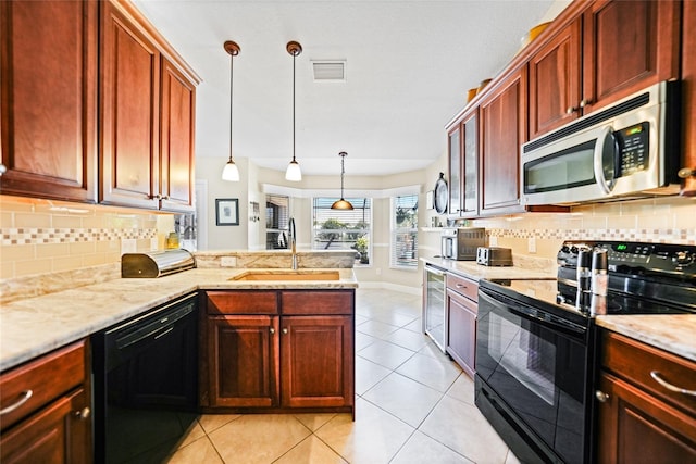 kitchen with backsplash, light tile patterned floors, a peninsula, black appliances, and a sink