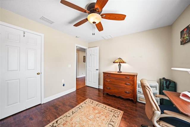 office area featuring visible vents, ceiling fan, baseboards, and wood finished floors