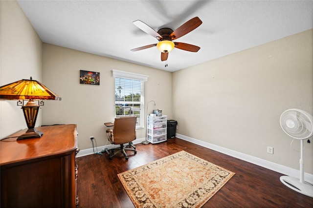 office space with dark wood-style floors, ceiling fan, and baseboards