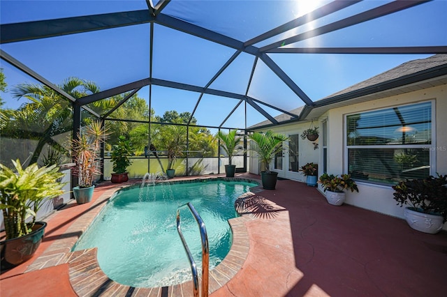 view of swimming pool featuring a fenced in pool, glass enclosure, and a patio