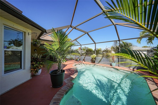 pool with a lanai and a patio