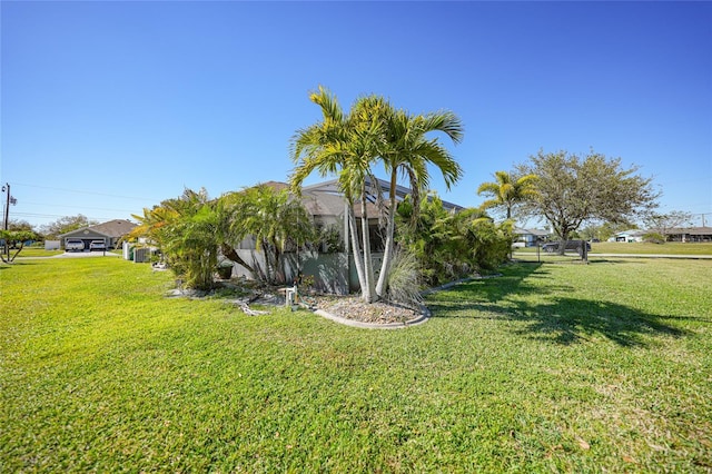 view of yard featuring a lanai