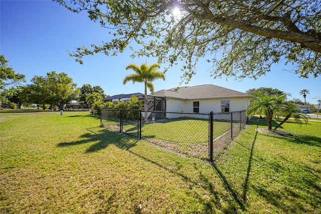 view of yard with fence and a gate