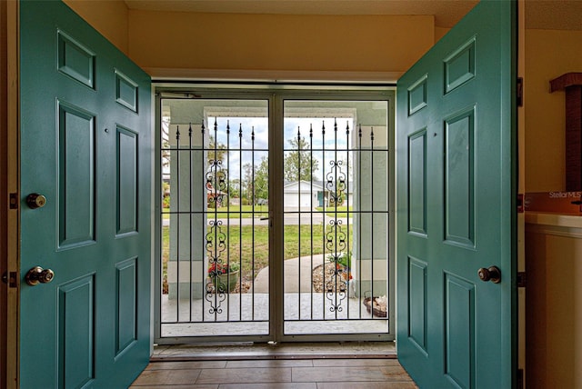 entryway with hardwood / wood-style floors