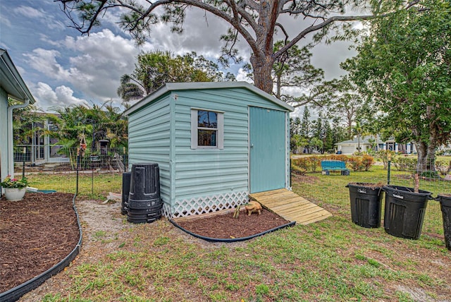 view of shed with fence