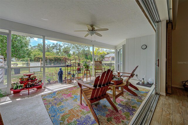 sunroom with ceiling fan and a wealth of natural light