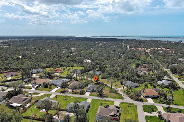 birds eye view of property with a water view and a residential view