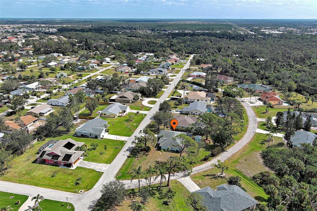 birds eye view of property featuring a residential view and a forest view