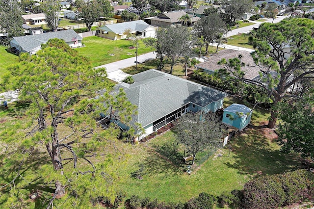 birds eye view of property with a residential view