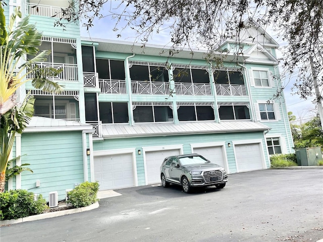 view of property with driveway and an attached garage