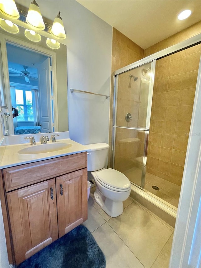 ensuite bathroom featuring tile patterned flooring, a shower stall, vanity, and connected bathroom