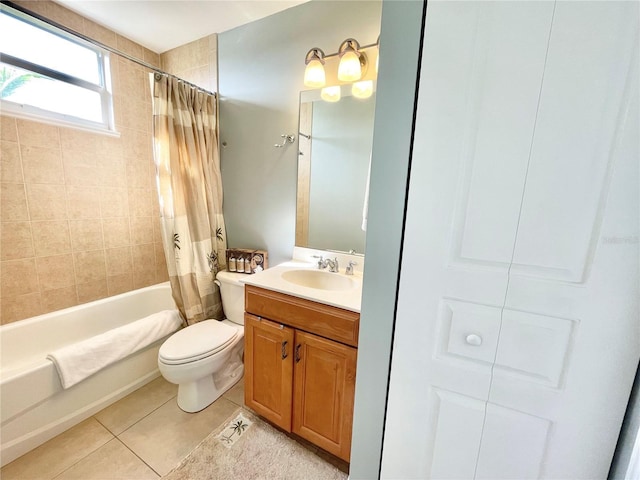 full bath with tile patterned floors, toilet, vanity, and shower / tub combo with curtain