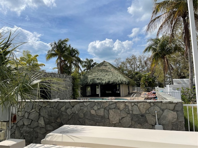 view of yard featuring a gazebo, a fenced in pool, a patio, and a fenced backyard