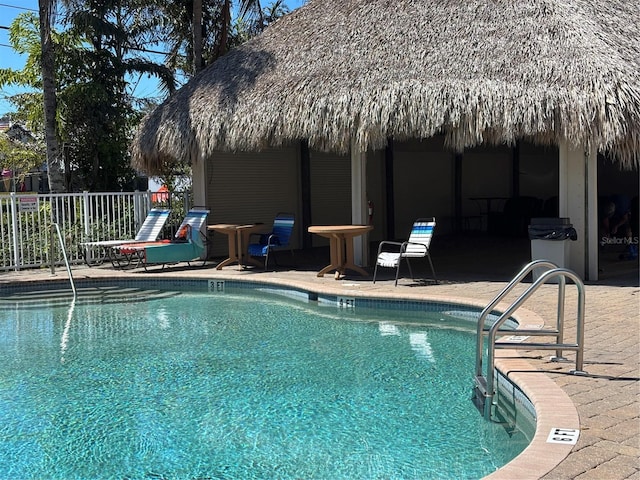 community pool with a patio area