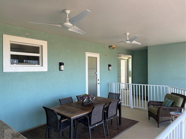 exterior space featuring outdoor dining space and a ceiling fan