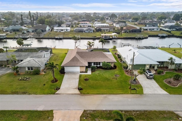 aerial view featuring a residential view and a water view