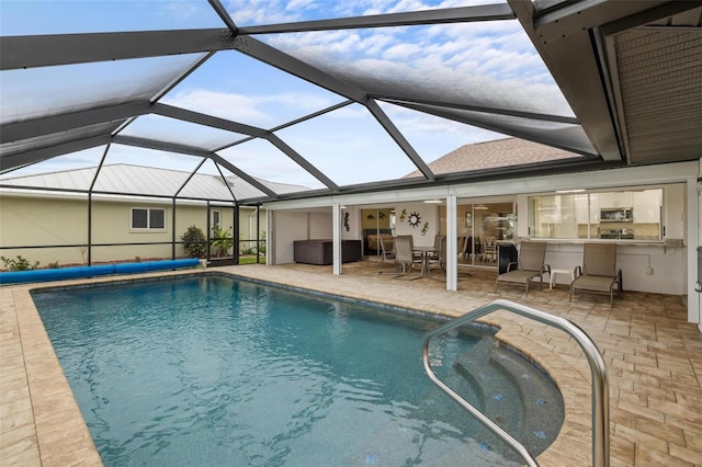 outdoor pool with a patio area