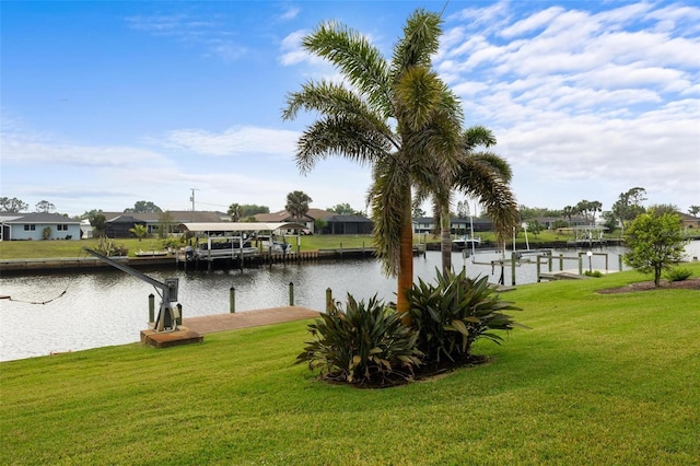 view of water feature with a dock, a residential view, and boat lift