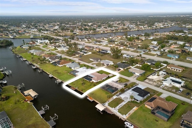 aerial view featuring a residential view and a water view