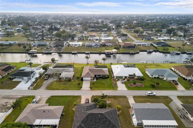 bird's eye view featuring a residential view and a water view