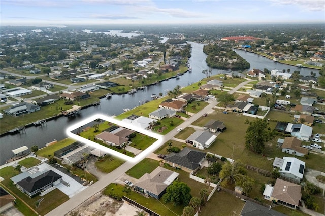 bird's eye view featuring a residential view and a water view