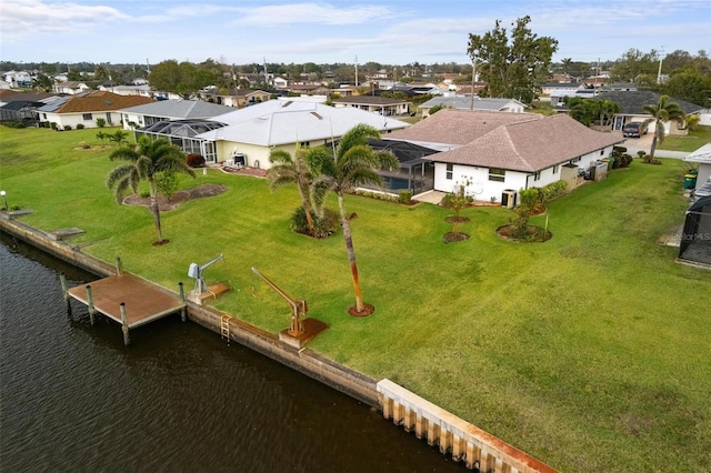 drone / aerial view featuring a residential view and a water view