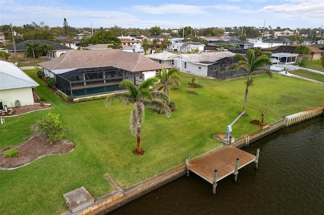 birds eye view of property featuring a residential view and a water view