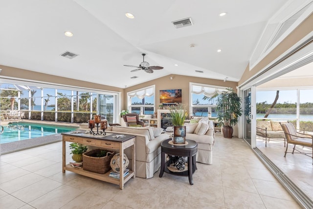 living room with visible vents, lofted ceiling, a healthy amount of sunlight, and a ceiling fan