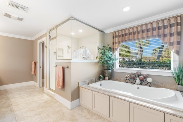 bathroom featuring crown molding, a bath, baseboards, and visible vents