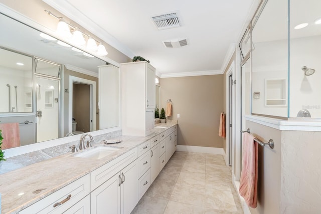 bathroom featuring visible vents, vanity, crown molding, and walk in shower