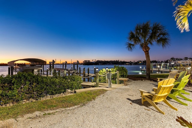 view of dock featuring boat lift and a water view