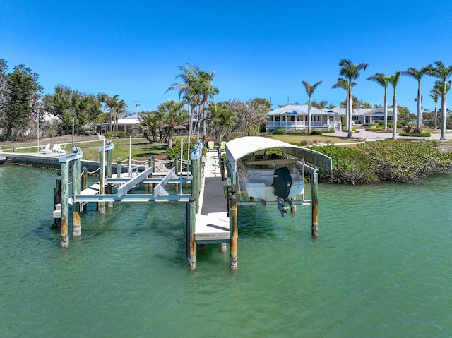 view of dock featuring a water view and boat lift