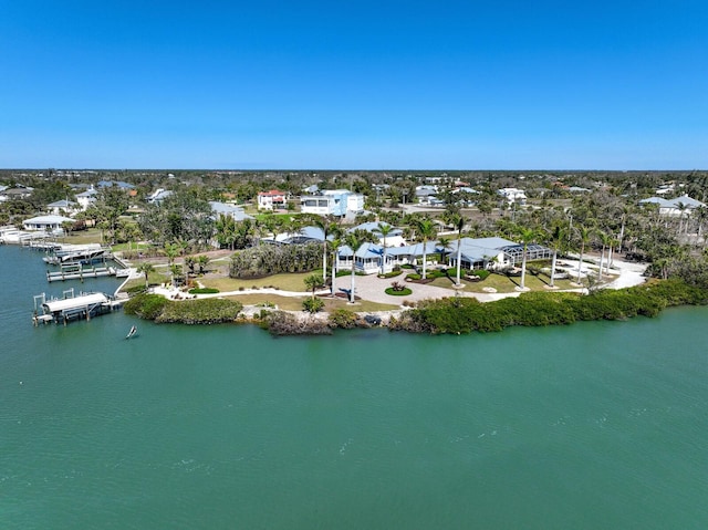 birds eye view of property with a water view and a residential view