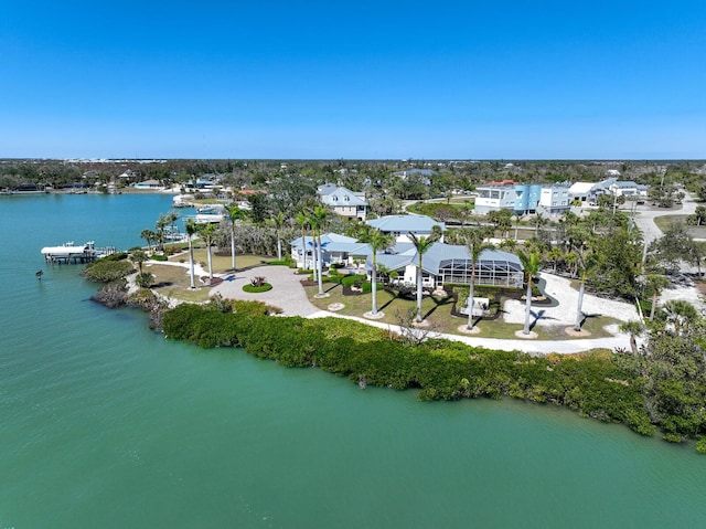 birds eye view of property with a residential view and a water view