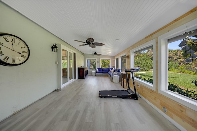 unfurnished sunroom with wood ceiling and ceiling fan