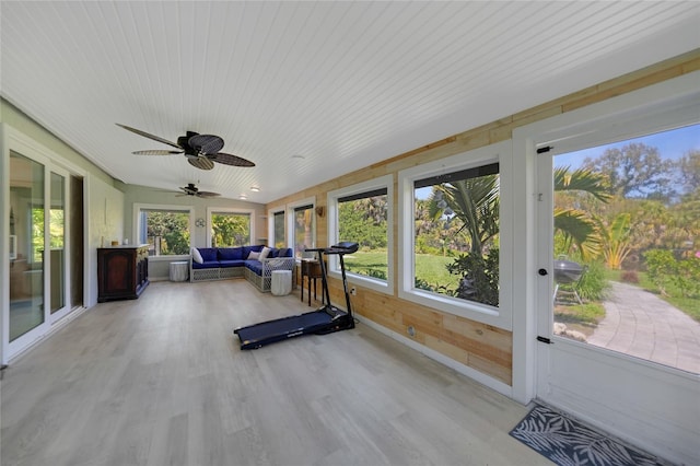 sunroom / solarium featuring wooden ceiling and ceiling fan