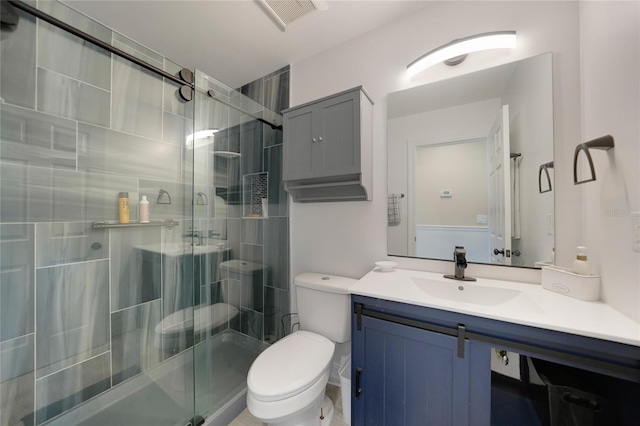 full bathroom featuring visible vents, toilet, a stall shower, and vanity