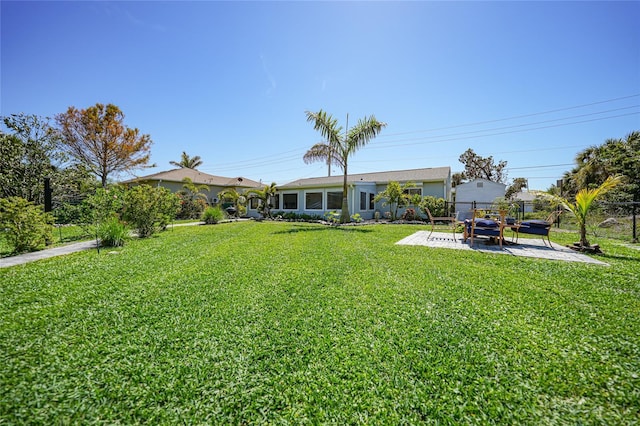 view of yard featuring a patio and fence