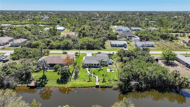 birds eye view of property with a residential view and a water view