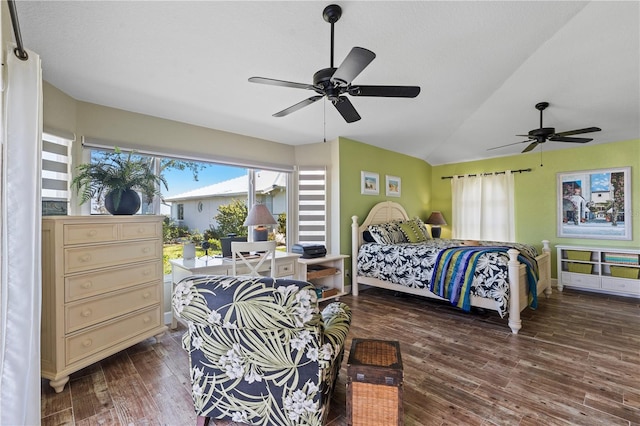 bedroom with a ceiling fan, lofted ceiling, and wood finished floors