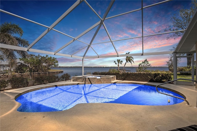 view of swimming pool featuring a lanai, a patio area, a water view, and a pool with connected hot tub