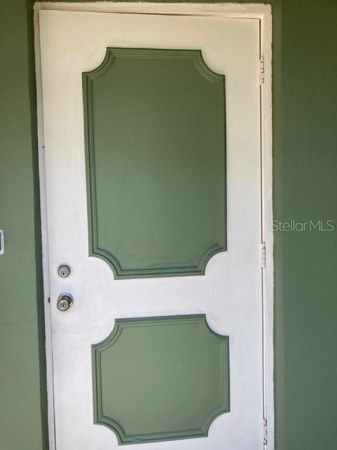 property entrance featuring stucco siding