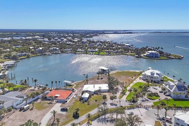 bird's eye view featuring a residential view and a water view