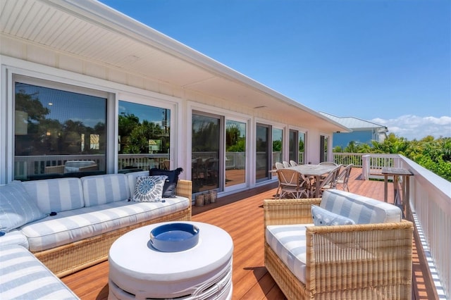 wooden deck with outdoor dining space