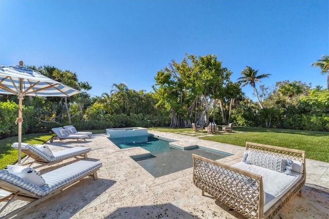 view of pool featuring a patio area, a lawn, and a pool with connected hot tub