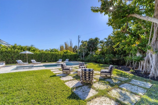 view of yard featuring a patio area and a fenced in pool